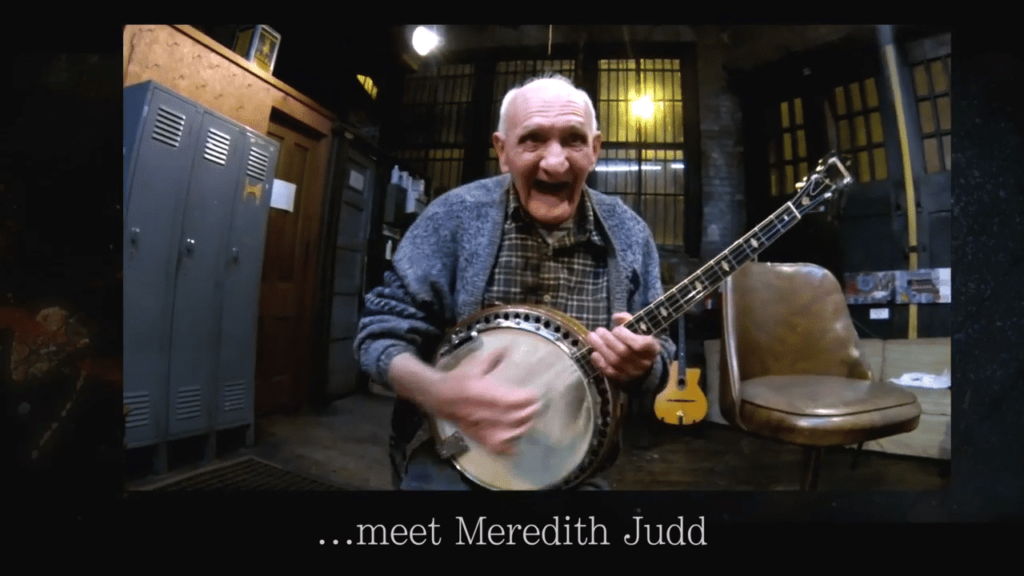 Our everyday hero Meredith, playing banjo music to create a feel good story.