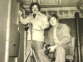Gene training one of his pupils on how to take a good picture. Another everyday hero.