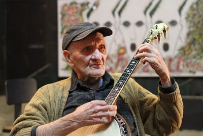 Meredith jammin' on his banjo. His legacy is a feel good story.