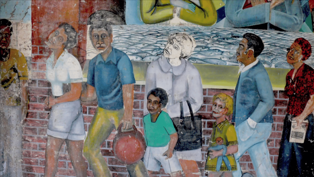 More mural art depicting a family walking on the neighborhood streets.